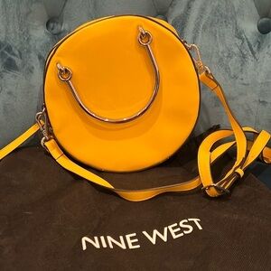 Woman’s Nine West Yellow satchel bag with adjustable strap